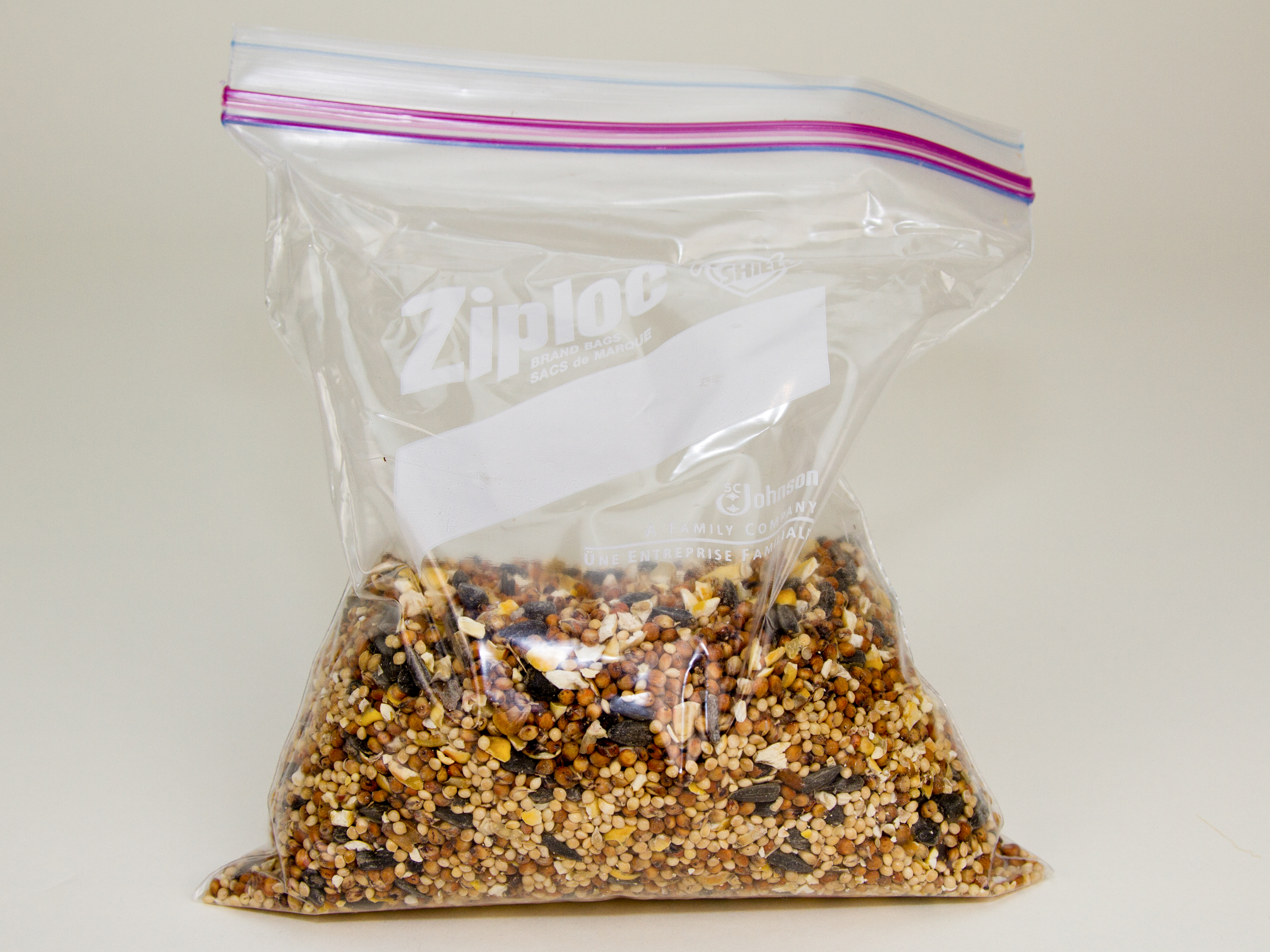Inner bladder with bird seed (zip lock bag)